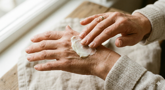 Hands applying tallow balm for skin barrier repair